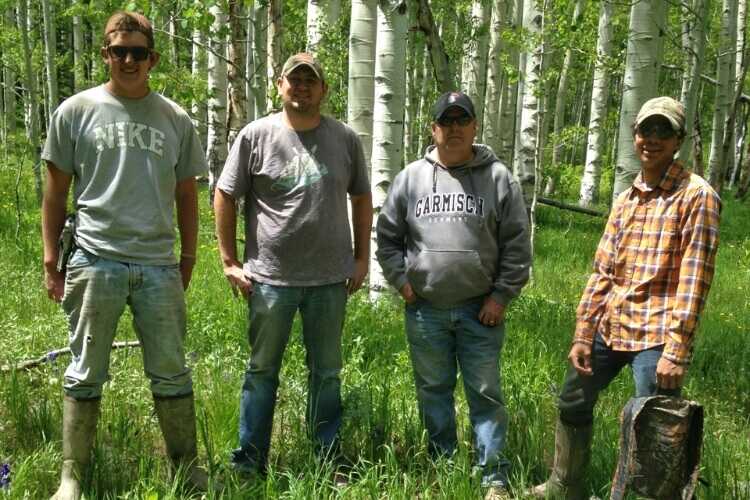 Hunters standing in woods