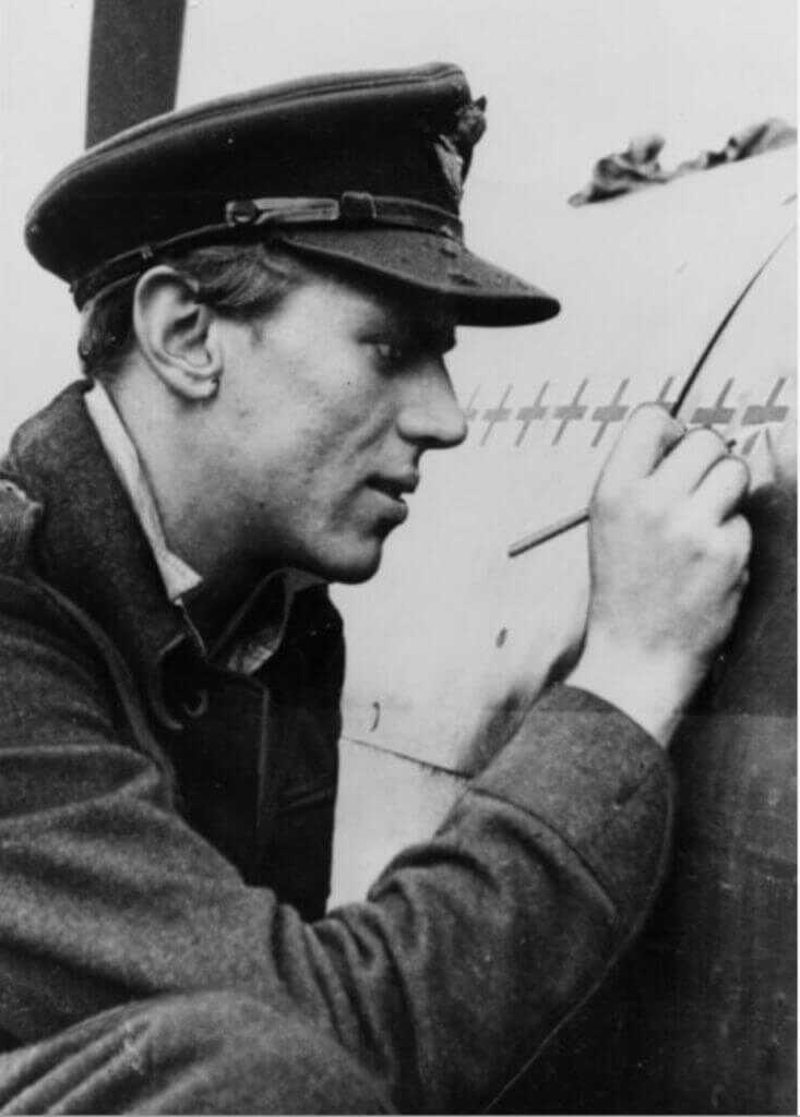 Pilot painting on the side of an ariplane