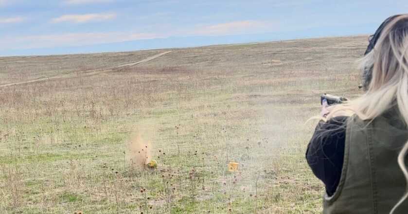 shooting the Beretta APX A1 Compact at watermelons