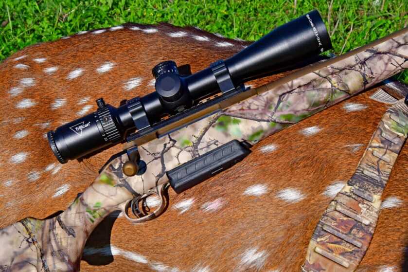 3 - Field Tested: Ruger American Go Wild Rifle in 7mm PRC Ruger American Go Wild Rifle in 7mm PRC with axis deer buck.