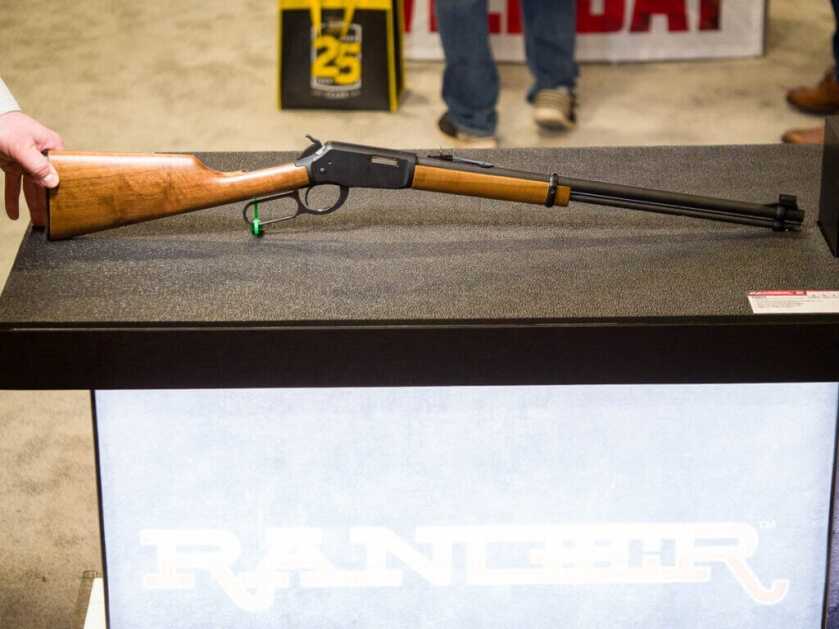 The whole gun is sitting on a table pointed to the right.