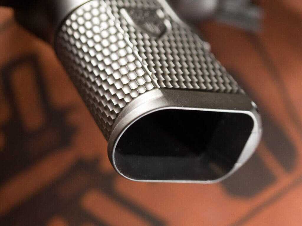 Close up view of the Cabot Guns Insurrection magazine well. It is slightly flared. The gun is tilted away and pointed to the left.