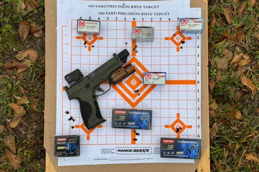S&W Spec Series Metal M2.0 with ammo lying on used target