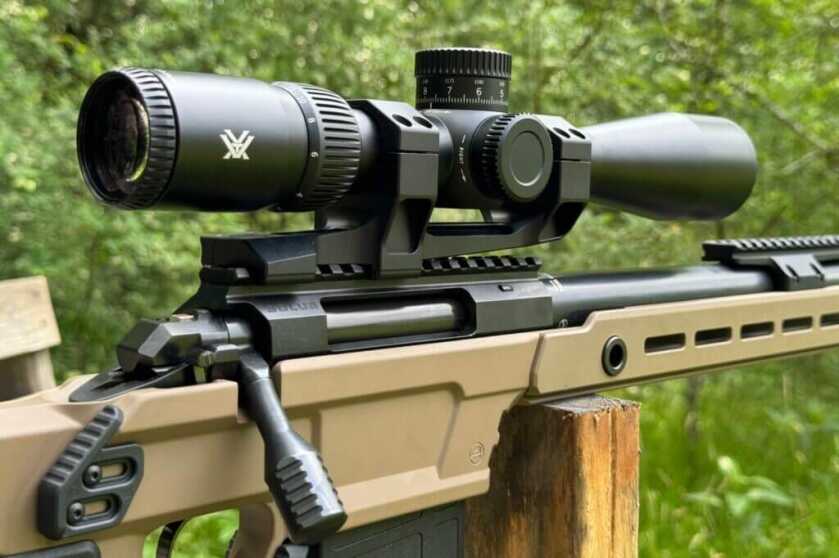 Vortex Viper HD 3-15 SFP installed on a rifle outside under leafy green trees