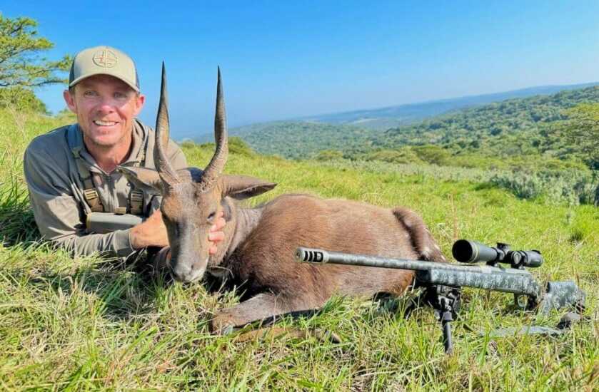 Hunter with Cape bushbuck from Africa