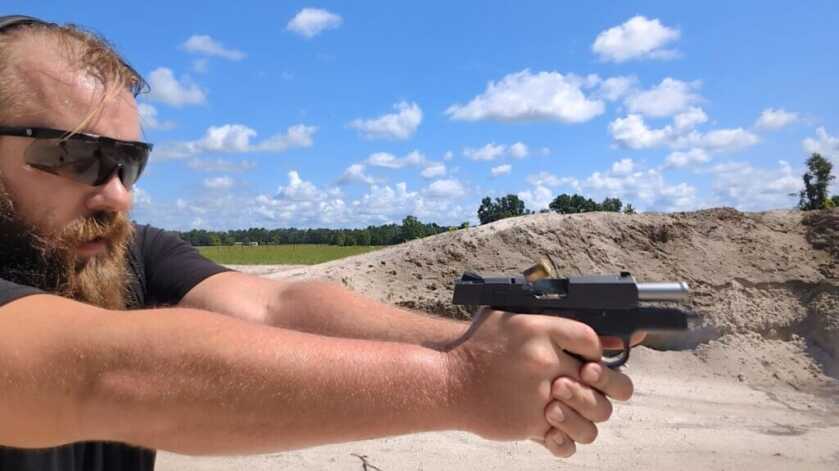 Man shooting Smith & Wesson 457 on the range