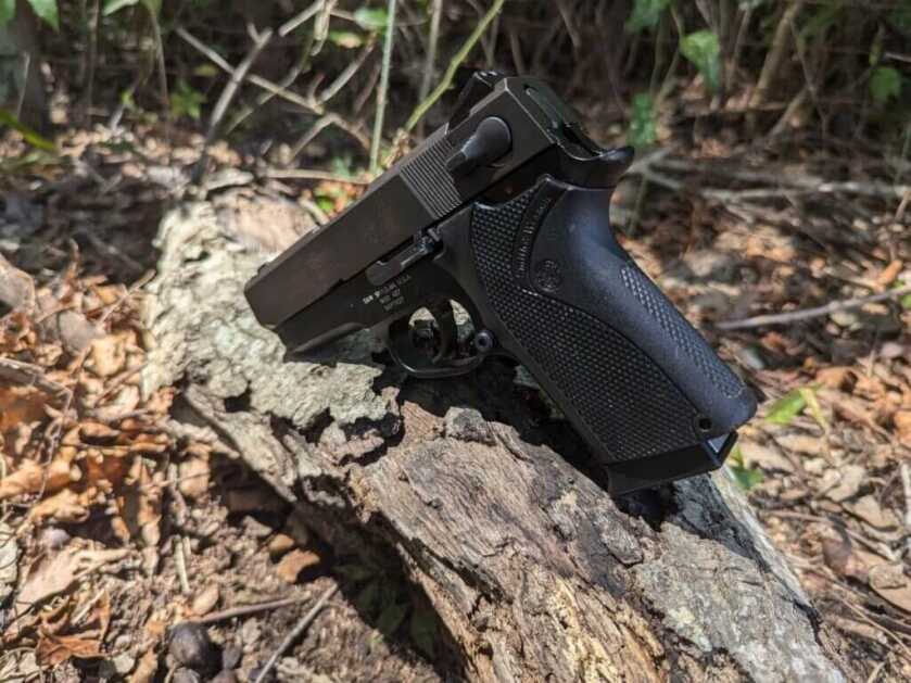 Third-generation handgun on tree stump