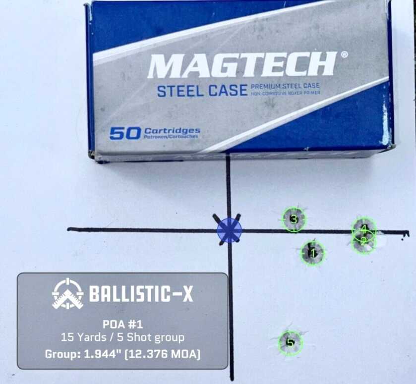 A used pistol target with a box of ammunition on top shows how accurate it is.