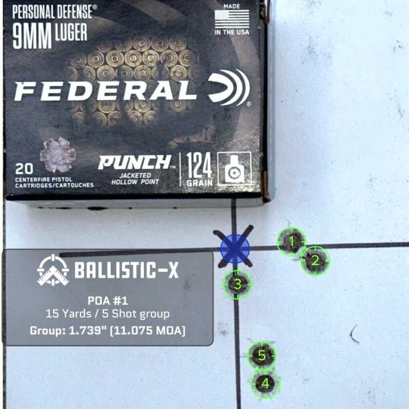 A used pistol target with a box of ammunition on top shows how accurate it is.