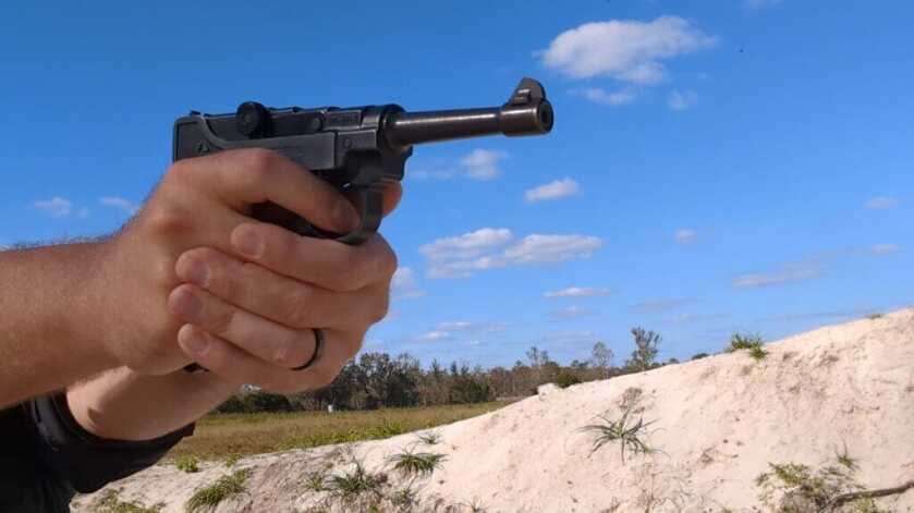 Man aiming the stoeger luger