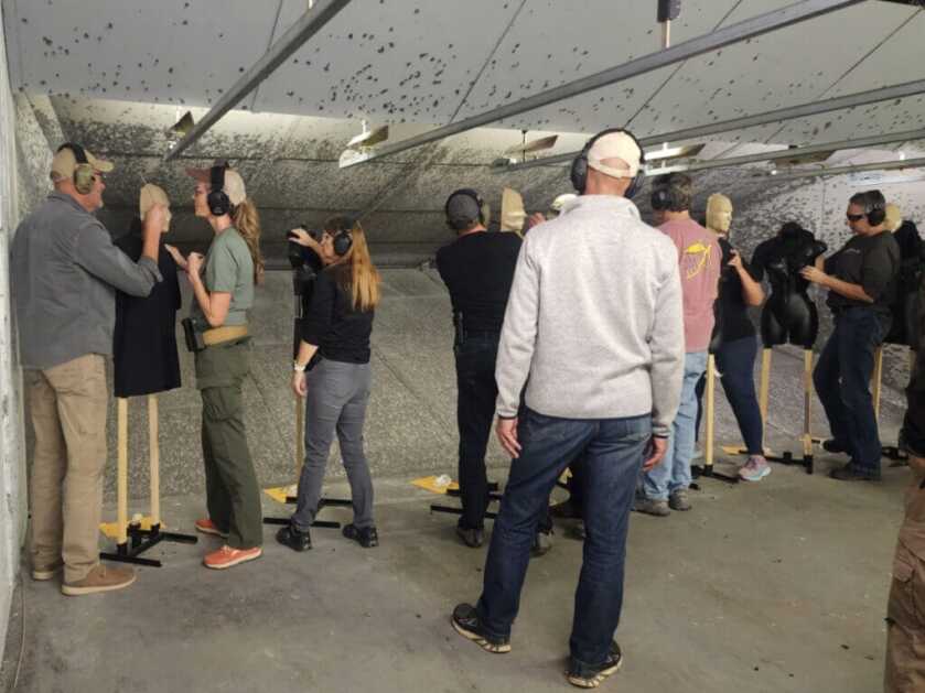 people shooting in a self-defense gun class