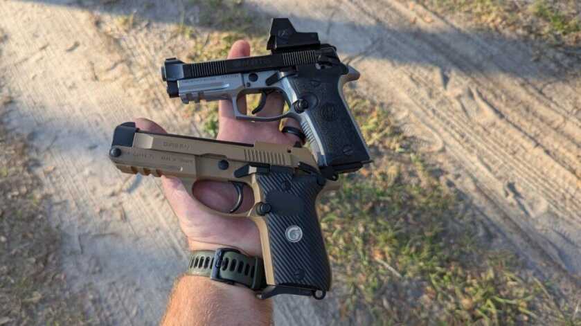 Beretta and girsan in hand