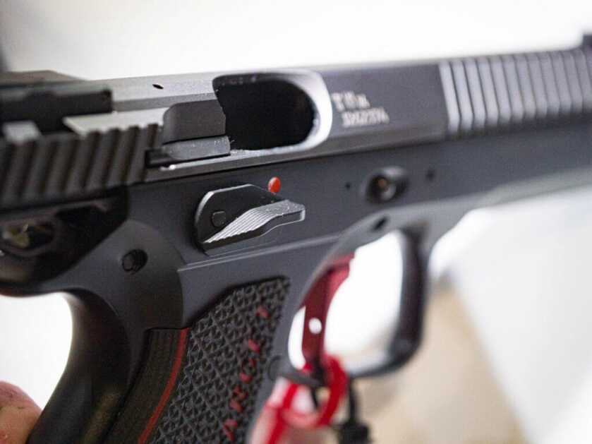 Close up view of the safety lever on the right side of the gun.