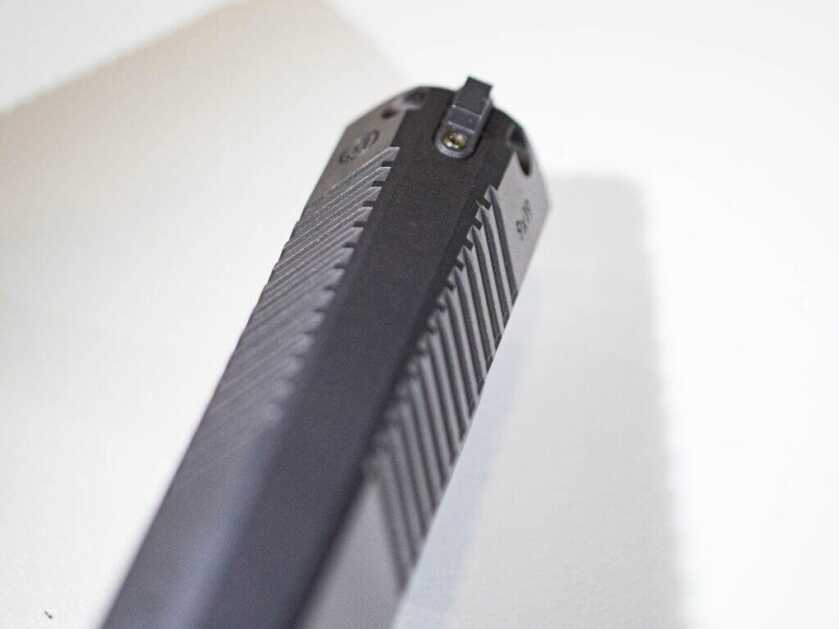 Close up of the front of the slide showing serrations and the triangular shape.