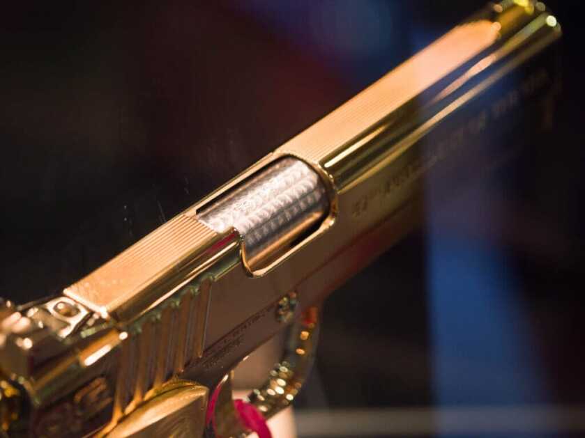 View of the top right side of the gun showing the leweled steel barrel.