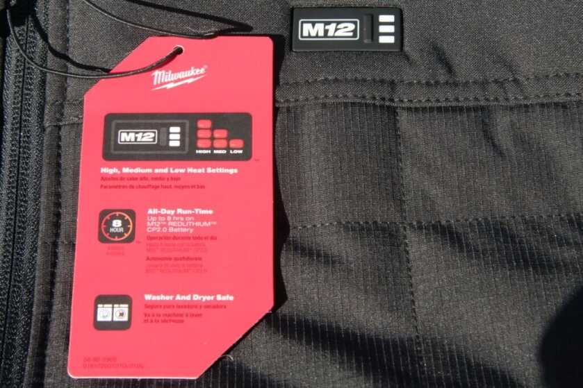 Milwaukee Axis heated vest outer shell close detail showing durable wind and water resistant fabric