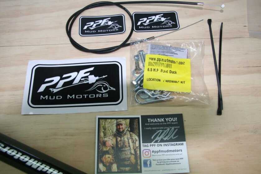 Bolts, throttle cable, stickers, and extras for PPF Wood Duck mud motor assembly