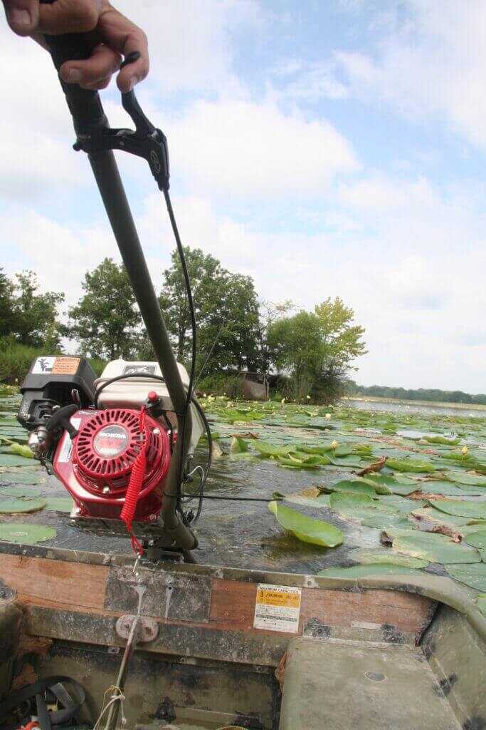 Operating PPF Wood Duck 55 inch long tail mud motor at idle showing tiller control and torque