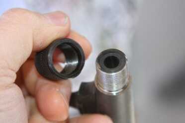 savage-hog-hunter-rifle-threaded-barrel The barrel is threaded for a suppressor, and comes with a screw on cap, so you could also use it for a flashhider if you wanted and suppressors aren't legal where you live, or not in your budget.