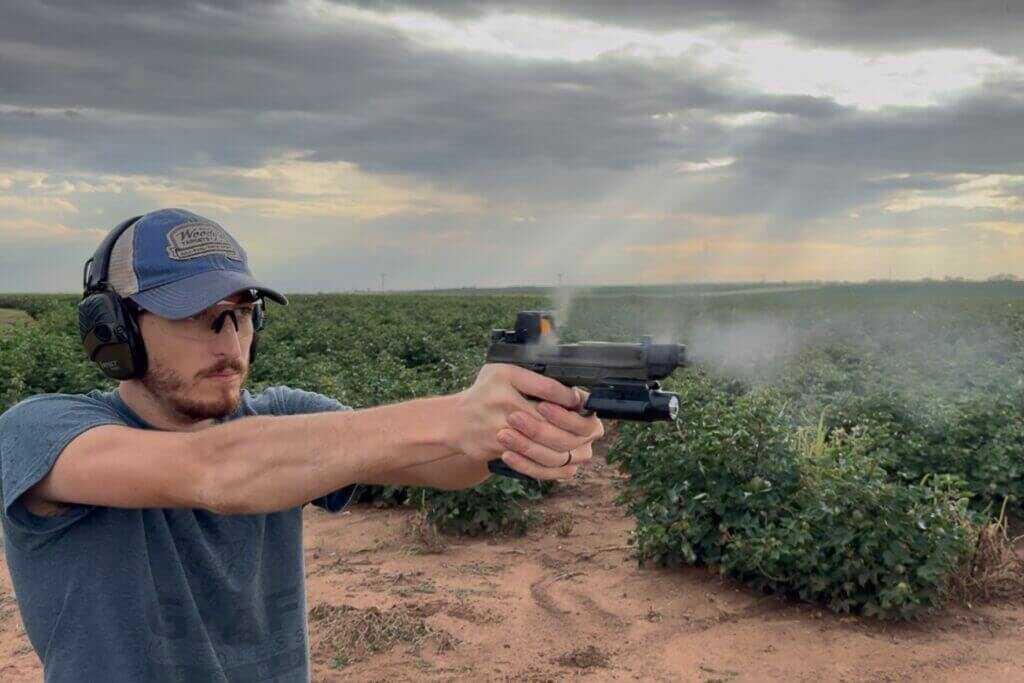 man shooting gun