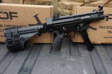 MP-5 Clone from Pakistan - Pakistani Ordnance Factory’s POF-5 The brace attaches to extension tubes. Here, without them, LOP is much shorter.
