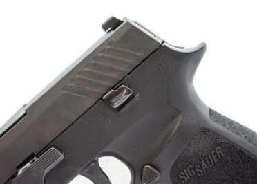 There are slide release levers on both sides.