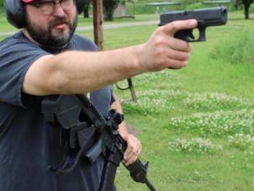 Glock out and ready to fire. 