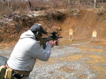 The AUG handles like a short barreled rifle but has the advantage of a 16 inch barrel for greater muzzle velocity.