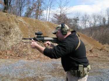 Typical shooting stance for the AUG. The High Rail on the AUG also creates plenty of mounting space for additional accessories or larger optics.