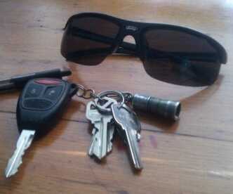 The Streamlight is the little silver tube on the key chain. This is about as small as lights come.
