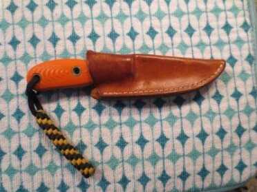 The leather sheath I carry the GW in.   I believe it was a custom sheath made by ArmorAllLeather.  Busse DOES NOT make sheaths or supply them when you purchase a knife.  