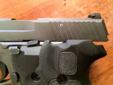 Brand New from Sig--Legion 9mm Pistol--Hands On Review I was a little worried that the new controls might not allow fitting of a Crimson Trace Lasergrip as they do not have the same cutout as the G10 grips, but the Lasergrips worked fine.