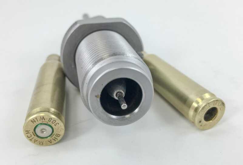 This Hornady .308 Winchester resizing die also has a decapping pin that knocks out the old primer. The case on the right has already been resized.