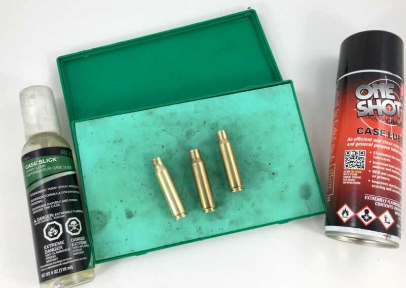 You need to lubricate bottleneck cases like these .308s before resizing. You can use a spray or roll them around on a grease pad like this.