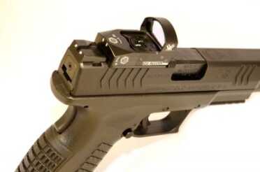 First Look! Springfield Armory XDM Optical Sight 9mm Pistol (OSP). Full Review. The optic mounting plate sticks out slightly on both sides, but the author still found the slide serrations easier to use on the XDM than on Glock or Smith & Wesson M&P with mounted optics.