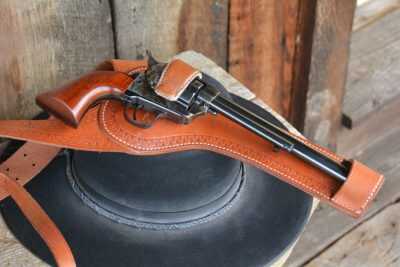 Shoulder holsters were becoming very popular by the late 1880s. Just before the turn of the century, Miles City, Montana holster maker Al. Furstnow developed his famous “Sheriff’s Lightning Spring Shoulder Holster,” which became the first “skeletonized” shoulder holster design. (Holster by El Paso Saddlery)