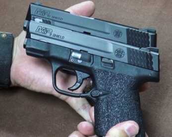Big-Bore CCW! New Smith & Wesson M&P .45 ACP Shield—Full Review The author felt that the dimensions of the Shield .45 (behind) and Shield 9mm (front) were quite similar.