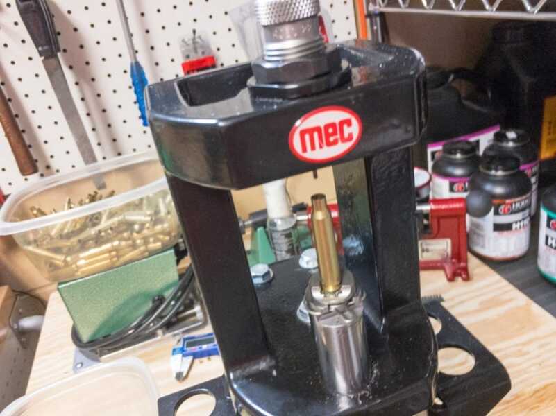 You'll need a press like this single-stage MEC to complete the seating and crimping steps. 