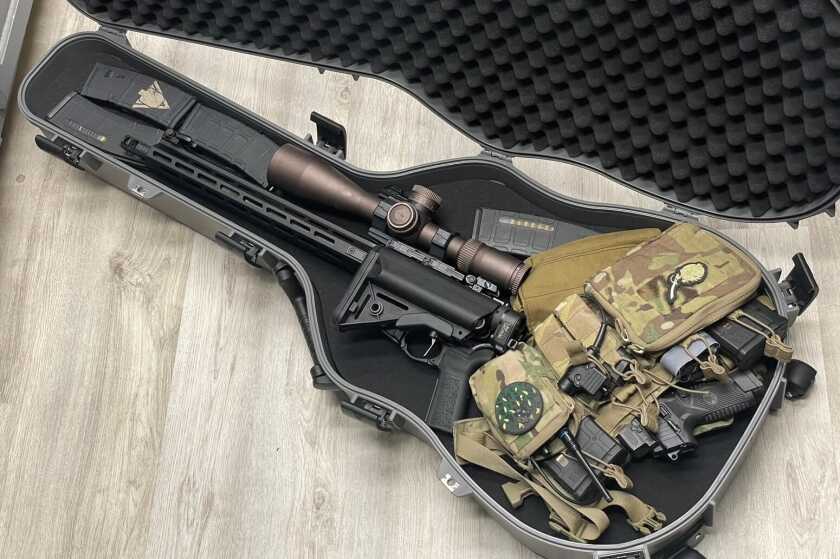 Using the Law Tactical folder to stuff the SAINT Victor into a Savior Equipment guitar case with a Haley Strategic chest rig