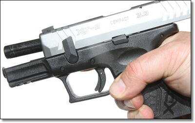 Simple disassembly and re-assembly is a big selling point for the XD line. You lock the slide back, flip that lever, and the slide comes off the front. 