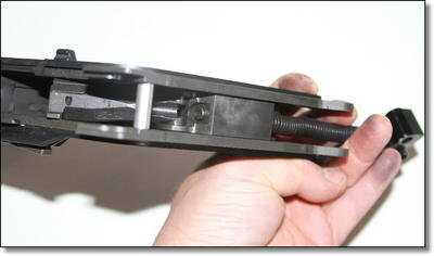 Pictures are very difficult to capture the bolt mechanism of the KRISS. This picture is from the top looking down, parallel to the travel of the bolt. That spring squishes at the bottom of the handle. You can see the bolt just turning the corner to downwards here. Pictures are very difficult to capture the bolt mechanism of the KRISS. This picture is from the top looking down, parallel to the travel of the bolt. That spring squishes at the bottom of the handle. You can see the bolt just turning the corner to downwards here.