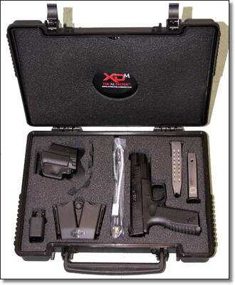This XD(M) comes with all of the standard case candy of the XD(M) line, including a holster, magazine holster, extra 19 round magazine and grip inserts for different sized hands. This XD(M) comes with all of the standard case candy of the XD(M) line, including a holster, magazine holster, extra 19 round magazine and grip inserts for different sized hands.