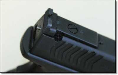 The adjustable rear sight is held by a pin that is held down in a machined slot in the slide. The adjustable rear sight is held by a pin that is held down in a machined slot in the slide. Out of the box you get the lowest profile sight possible, and it is of the highest quality for competition shooters.