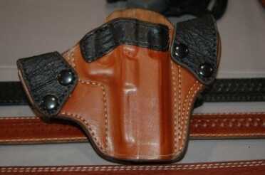 The new sharkskin / leather combination holsters: open top, in both black and brown. Give your gun something classy to ride in.