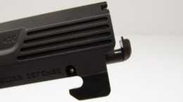 The spring loaded extractor easily lifts spent hulls and brass from the chamber. The massive under-barrel locking lug locks the barrel to the frame when firing.)