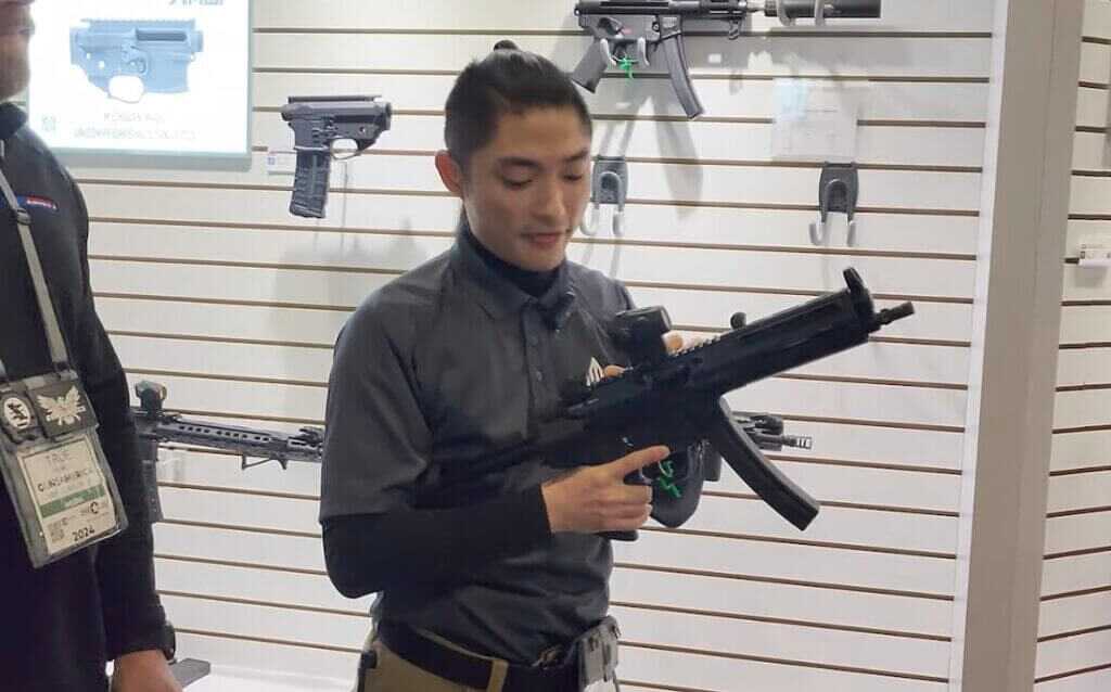 Kio from Leapers holding the handguard.