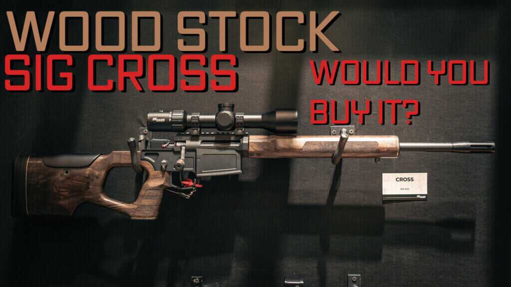 A SIG Cross rifle with wood furniture hanging on a wall.