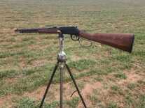lever-action rifle on sticks