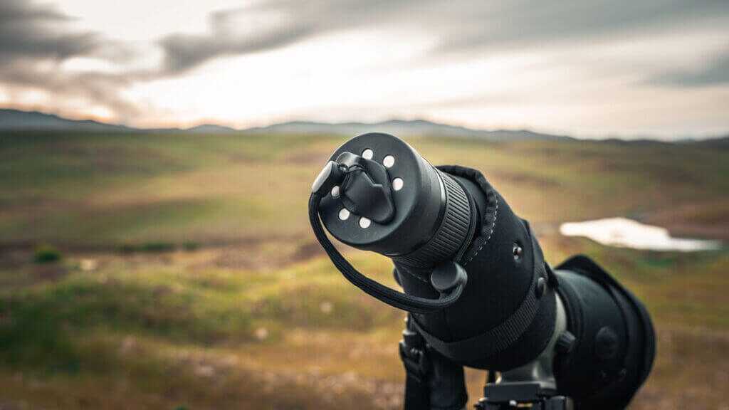 magnetic lens cover on a spoting scope