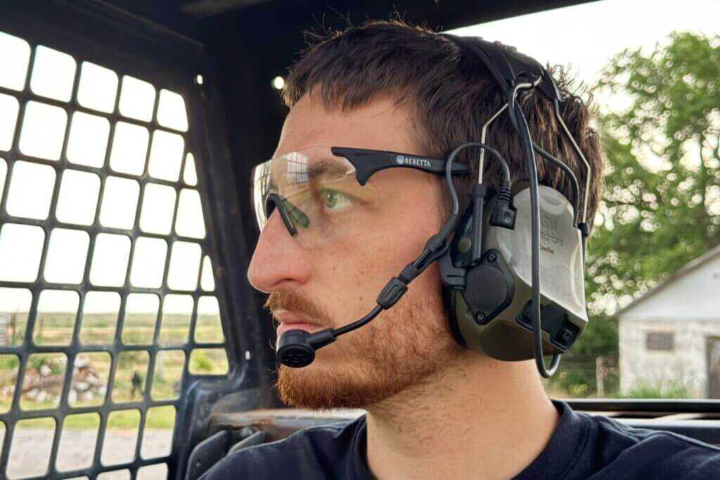 ComTac VIII with downlead connected to PTT and handheld radio for clear tactical communications